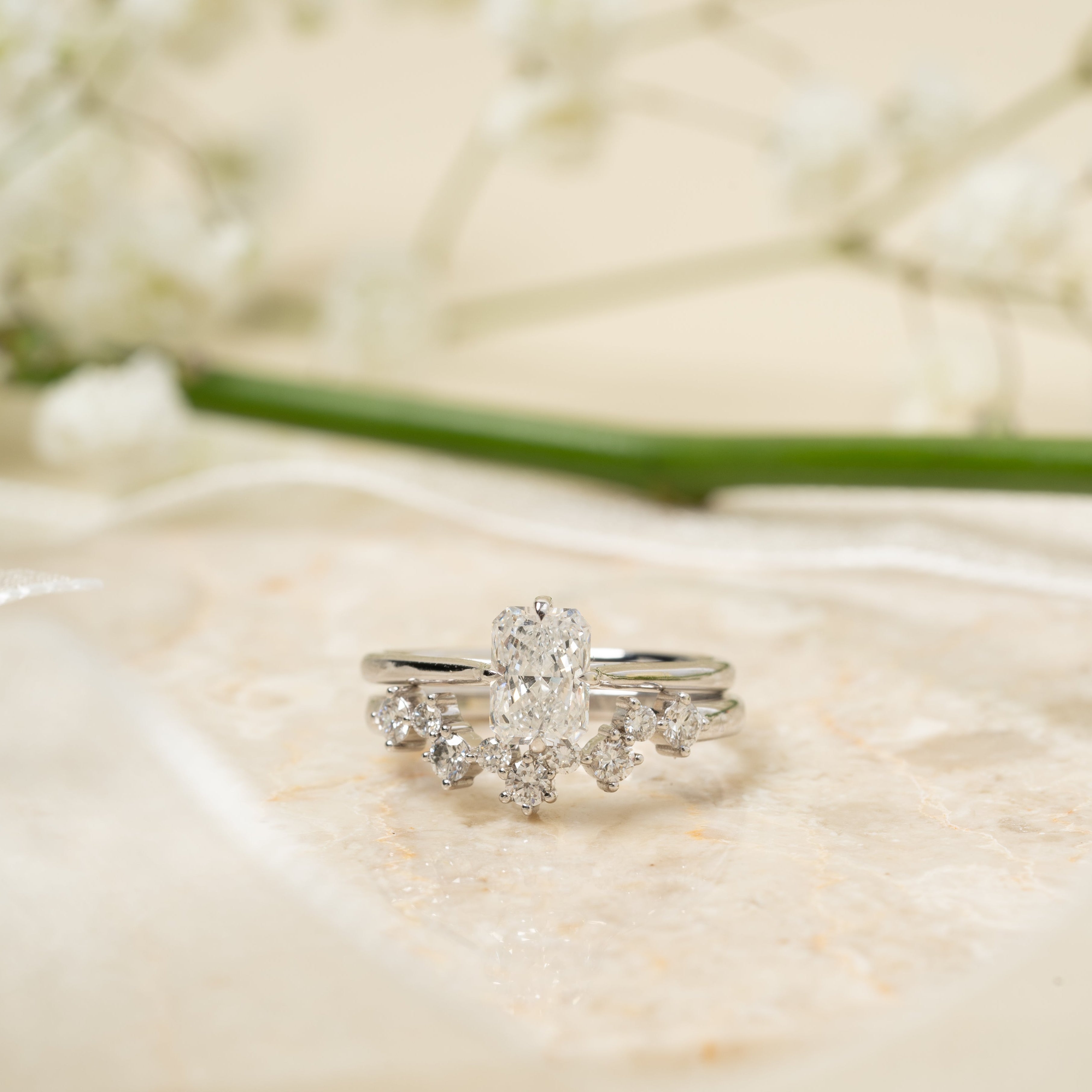 White Gold and Diamonds ring with a diamond on a white fabric background